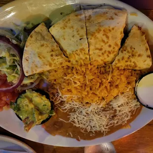 Steak quesadilla with a side of rice and beans