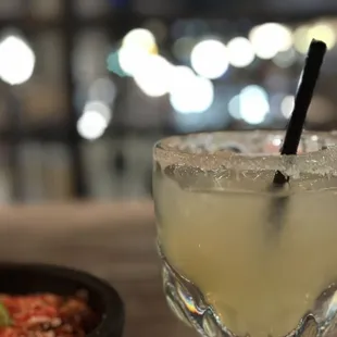 a margarita in a glass with a straw