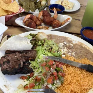 Carne asada, bacon wrapped shrimp, side of nopales and grilled cheese