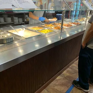 a man standing in front of the counter