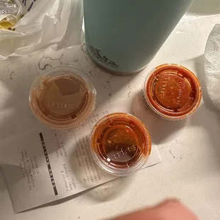 two cups of coffee and a bottle of water