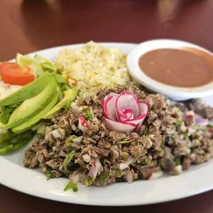 Carne deshilada - shredded beef, beans, and salad