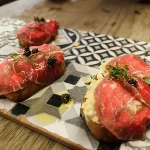 Montadito&apos; de bou/Filet mignon carpaccio $15 as of 12,2023