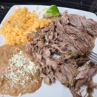 Barbacoa plate with rice and beans. Meat is goat not beef