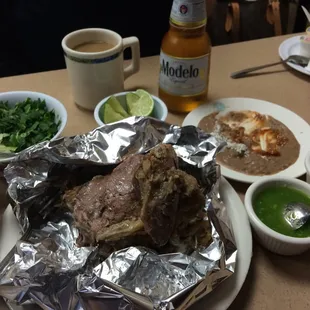 Barbacoa de borrego $14 for a pound of lamb meat with a little bit of bones - comes with tortilla, salsa, frijoles
