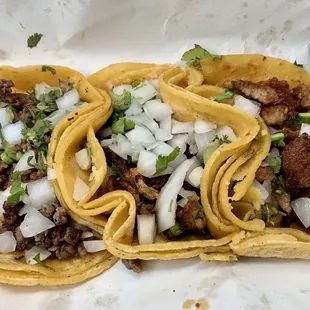 two tacos with meat and onions