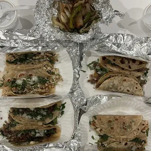 Chicken tacos (top left and bottom right), fajita tacos (bottom left and top right)