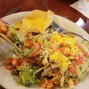 Summer plate, mini taco shell underneath that is flipped over so the plate looks like it has far more food then it actually has.