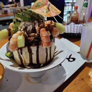 Coconut with shrimp octopus,  and more with coconut water on the side.