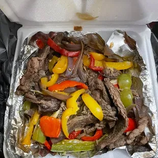 My fajitas. A lot came in the container, sure but not a speck of seasoning to be found and the steak is dry and chewy. So colorful, so awful