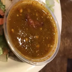 Spicy house tomatillo sauce flavor punch