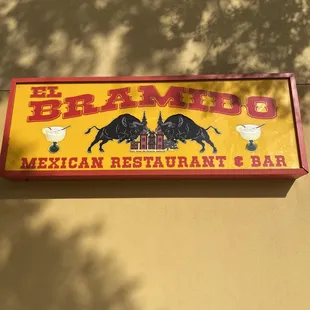 a sign for mexican restaurant and bar