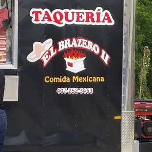 a woman standing in front of the truck