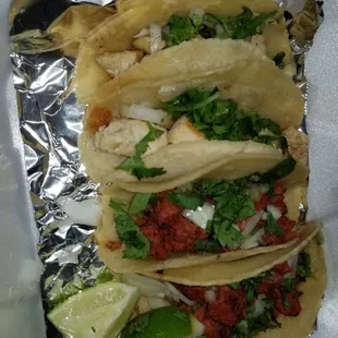 three tacos in foil