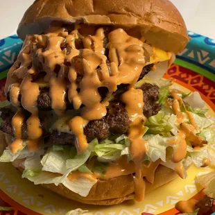 a hamburger with cheese and lettuce