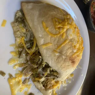 a plate of food with a burrito