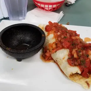 Small burrito for 9.00 plus change salsa cup half size of burrito