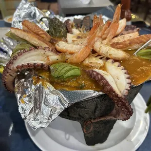 Molcajete el Patron- this bad boy has octopus, cactus, fish, shrimp all swimming in a semi spicy sauce.  Alot of food come ready to eat.