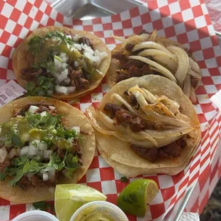 Barbacoa tacos on the left
