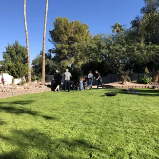 a group of people in a backyard