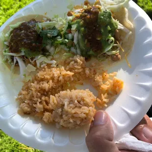 a person holding a plate of food