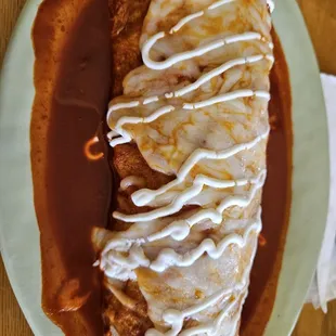 Wet pastor burrito with red sauce