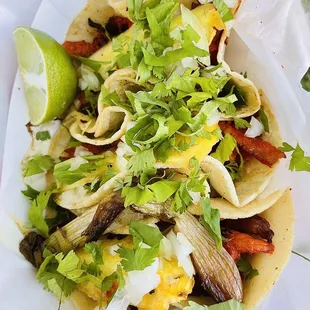 Three Tacos El Pastor ($10) with onions and cilantro from their truck at a food truck night.  Delicious!