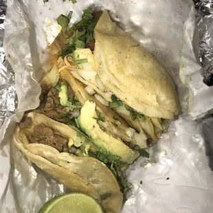 4 tacos = steak, chicken and tripa