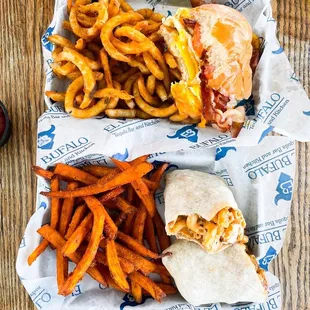 Top: breakfast sandwich with curly fries, bottom: Nashville burrito with sweet potato fries