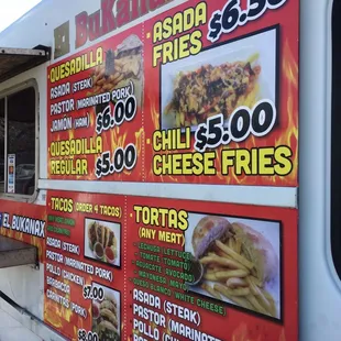 a menu on the side of a food truck