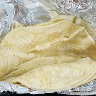 Corn tortillas: brought out hot (generous portion).