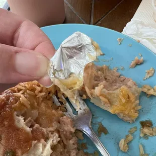 Tin foil found inside burrito.