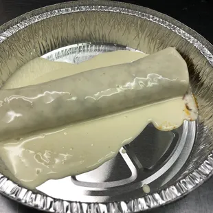 Graund beef burrito with cheese on top !!