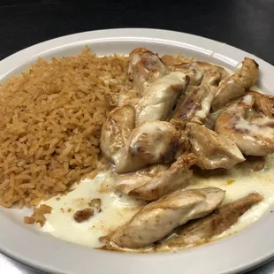 Grill chicken and cheese on top with rice 
                     (Pollo bandido)