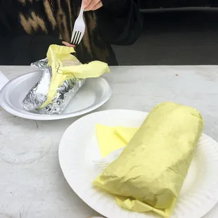a person eating a burrito