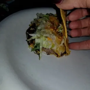 Massive amount of meat in the shredded beef in these tacos. Worth it!!.