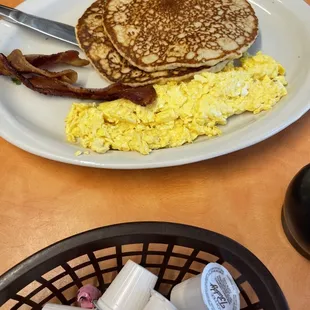 This plate is called the breakfast special . 2 pancakes, 2 bacon &amp; 2 eggs.