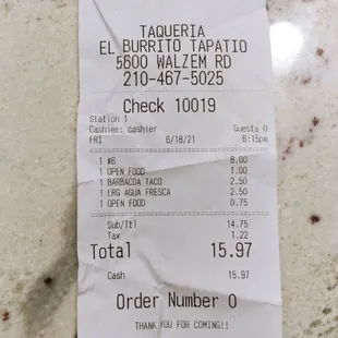 My bill with $1.00 tomatoes and 75¢ raw onions charged