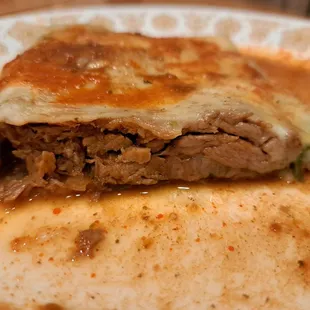 Inside the Birria Giant Quesadilla with Consome on top