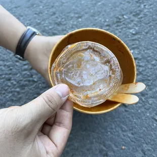 Plastic Lid fished from the bottom of my pozole left  behind by the restaurant