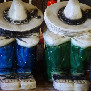 two ceramic figurines of a man and a woman