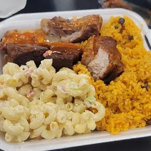 Hot bar, they pretty only speak Spanish and I think I broke their rules because I got 1 rib and some pork belly with rice and Mac salad.