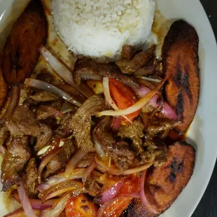 Dinner #3. Peruvian style beef with tomatoes and onions. I swapped the fries for plantains. Delicious!