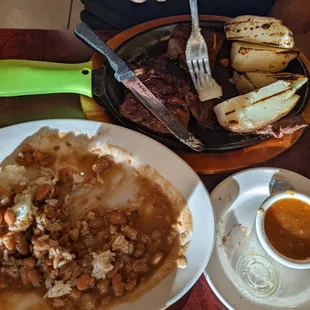 Steak potatoes, beans and rice
