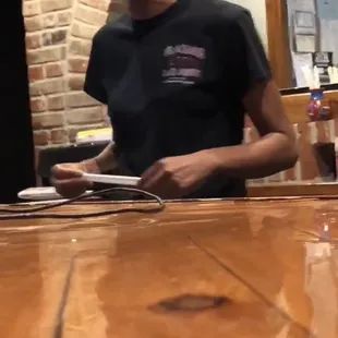 a woman sitting at a bar