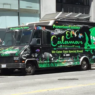 a black and green food truck