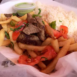 Lomo Saltado: Stir-fried beef, fries, rice | $11 (no bueno: dry, chewy beef w/ hard, undercooked rice)