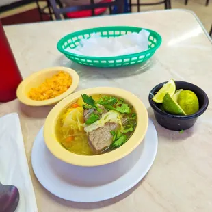 a bowl of soup and a bowl of rice