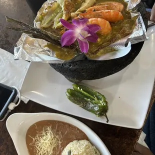 Molcajete beef chicken and shrimp