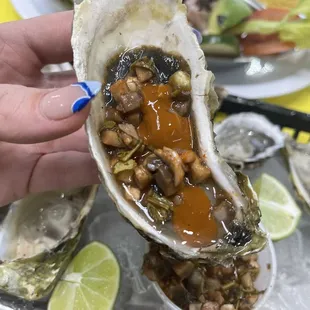 a person holding an oyster